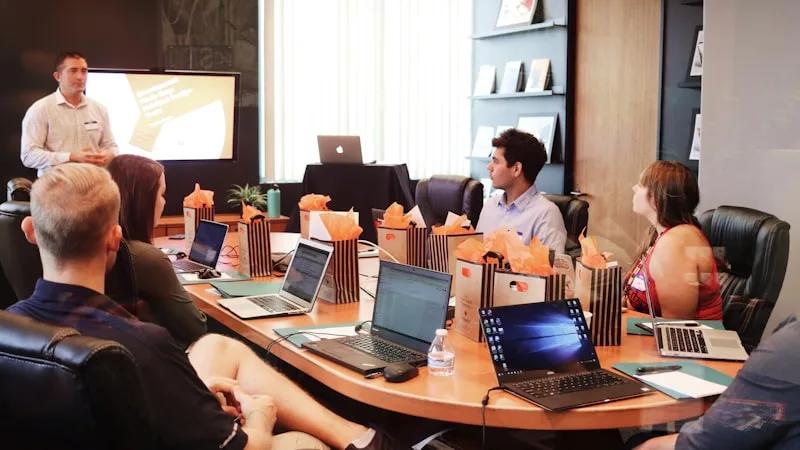Trader reviewing their weekly trading journal on a laptop with a coffee, identifying performance patterns